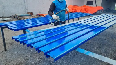 Powder coated steel sheets in blue showing durable metal coating finish Melbourne